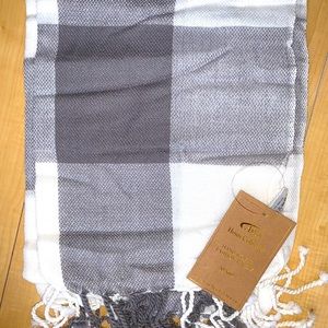 Brownish gray and white plaid throw